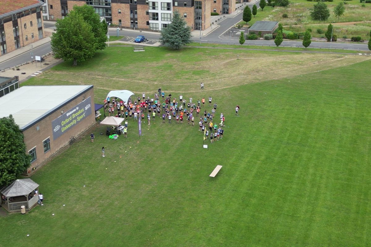Runners gathered for the briefing beside the sports building, seen from above