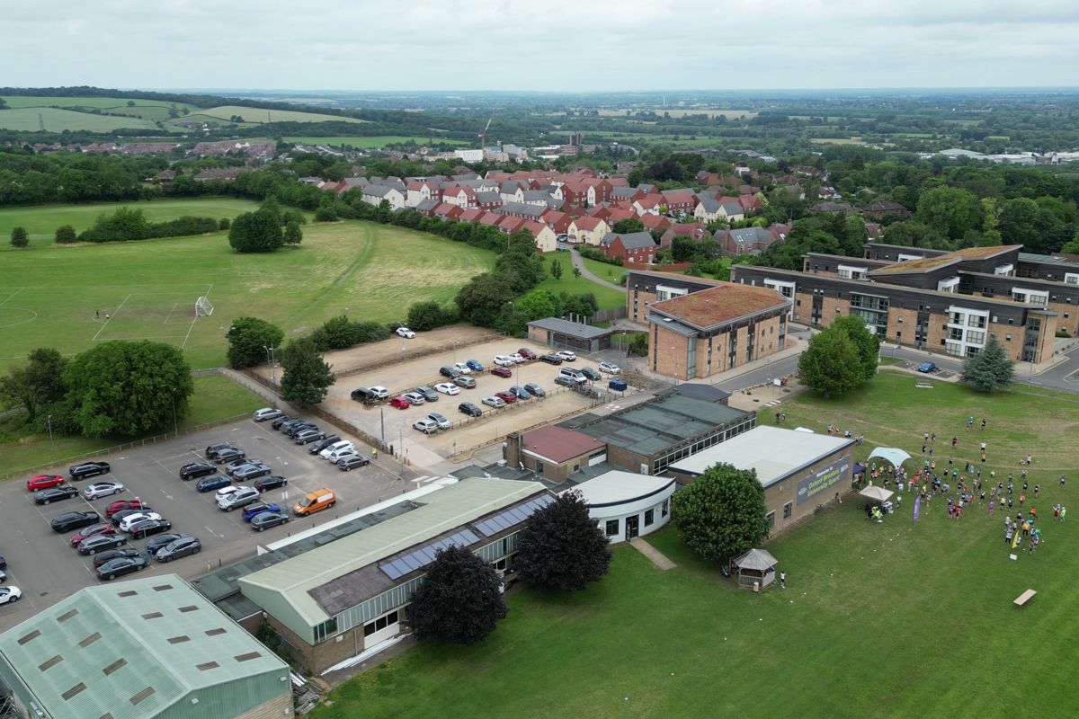 Aerial view across farmland from the start field